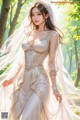 A woman in a wedding dress standing in the woods.