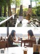 A couple of women sitting at a table in a restaurant.